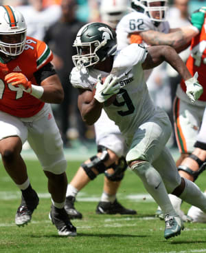 Kenneth Walker III on the run vs. Miami.